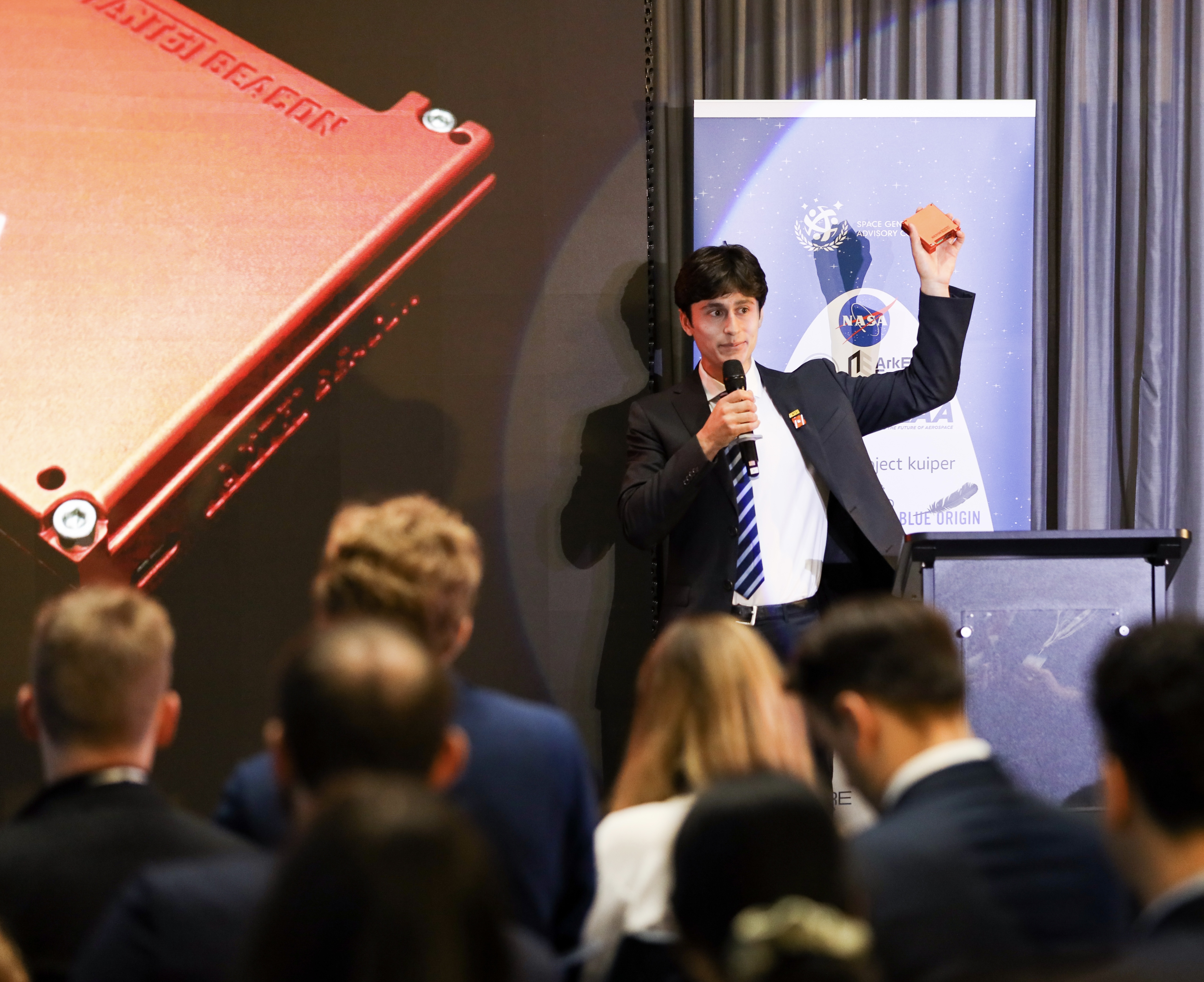 Speaker presenting at an event.